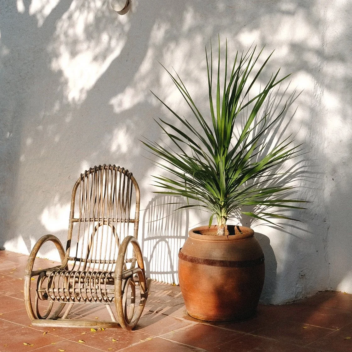 Rattan chair on the terrace at Masia Can Pares